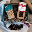 Load image into Gallery viewer, Tea packaged with Vegan Traditional Welsh Cakes in a gift box on a busy kitchen worktop