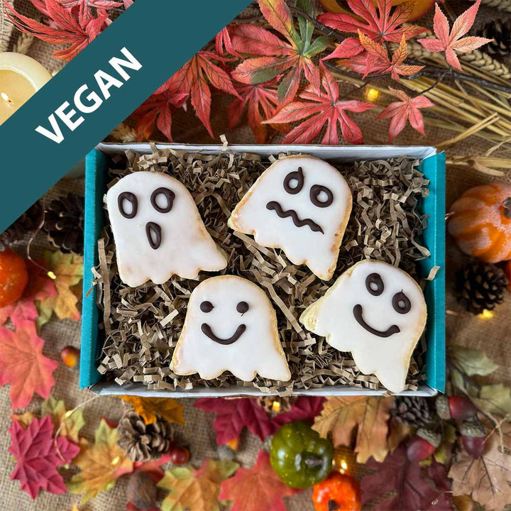 Gift Box of vegan ghost Welsh Cakes with autumn leaves and pumpkins in the background