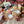 Load image into Gallery viewer, Three Chai flavoured Welsh Cakes with triangle icing on a wooden board with Halloween-themed decorations in the background.
