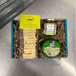Load image into Gallery viewer, heese &amp; Leek Savoury Gift Box - a teal cardboard box filled with packaging with a pack of Cheese &amp; Leek welsh cakes with a green label, a green wax Leeks cheese, and green label jar of chutney
