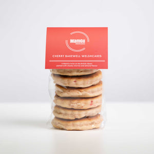 Packaged cherry bakewell Welsh Cakes with a red MamGu Welshcakes label on a white background