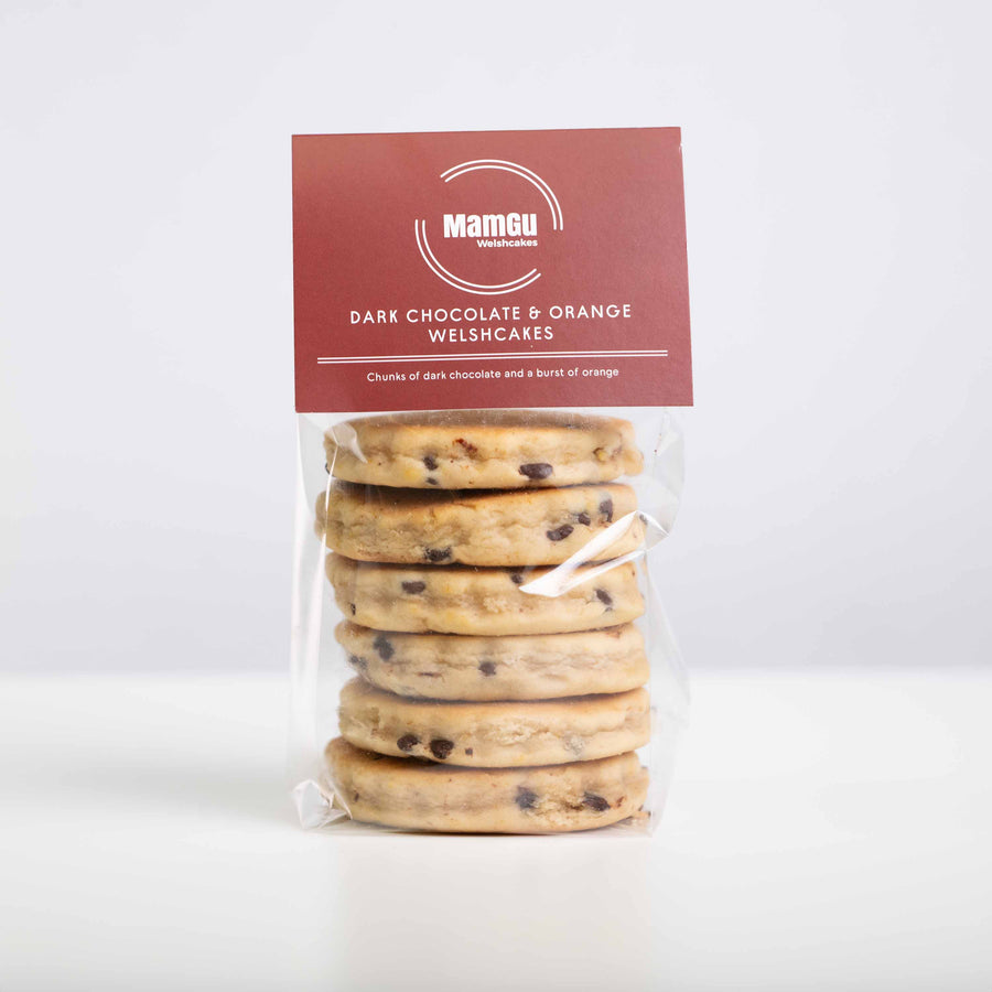 Packaged dark chocolate and orange Welshcakes with MamGu Welsh Cakes label on a white background