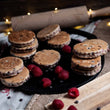 Load image into Gallery viewer, Loose Dark Chocolate &amp; Raspberry Welshcakes on a messy rustic kitchen worktop with loose raspberry and chocolate chips

