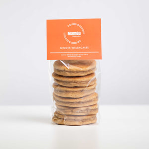 Packaged Ginger Welsh Cakes with an orange MamGu Welshcakes label on a white background