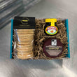 Load image into Gallery viewer, Marmite &amp; Cheese Savoury Gift Box - a teal cardboard box filled with packaging with a pack of Marmite &amp; Cheese welsh cakes with a black label, a black wax Caws Cryf cheese, and jar of marmite
