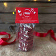 Load image into Gallery viewer, Red Velvet Valentines Welsh Cakes with a hessian and wood background and red ribbon. 
