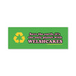 Load image into Gallery viewer, A rectangular green bumper sticker with a yellow recycling symbol and pink text that reads, 'Save the earth, it's the only planet with WELSHCAKES'.
