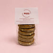 Load image into Gallery viewer, Packaged strawberries &amp; cream Welshcakes with Mamgu branding on a pink background
