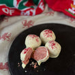 Load image into Gallery viewer, 4 strawberry welsh cake balls covered in white chocolate
