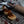Load image into Gallery viewer, Vegan Cheese and Leek Welsh Cakes on a cooling rack with a chutney on top
