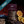 Packaged dark chocolate orange Welshcakes with oranges and chocolate pieces on a wooden board.