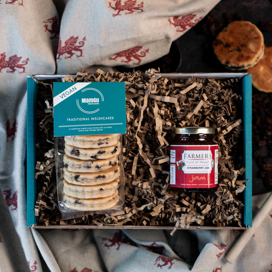 Gift Box with packaged Traditional Welsh Cakes and Strawberry Jam on a Welsh dragon table cloth