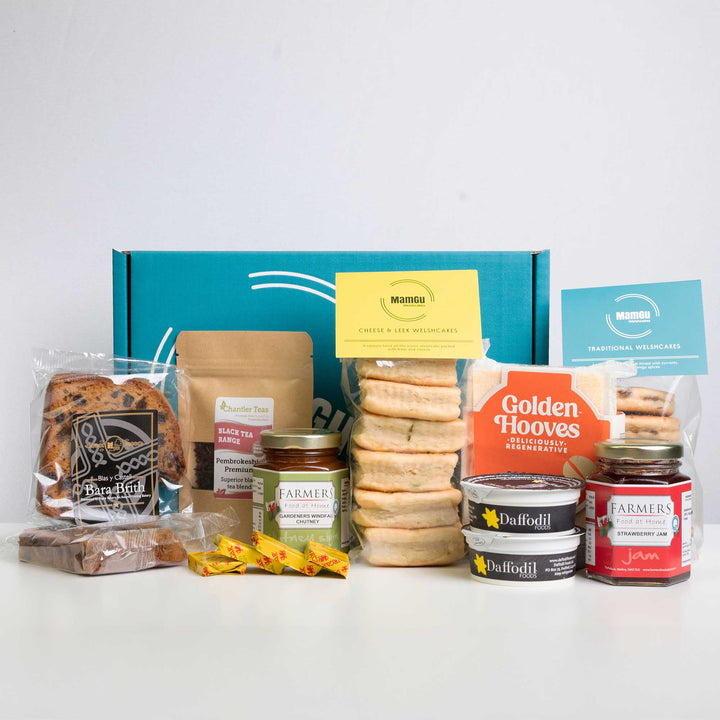 Welsh Afternoon Tea Gift Box with all the contents laid out on a studio white background