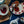 Welsh Cakes with strawberry jam and clotted cream on a decorative plate, surrounded by a bowl of jam and a teapot